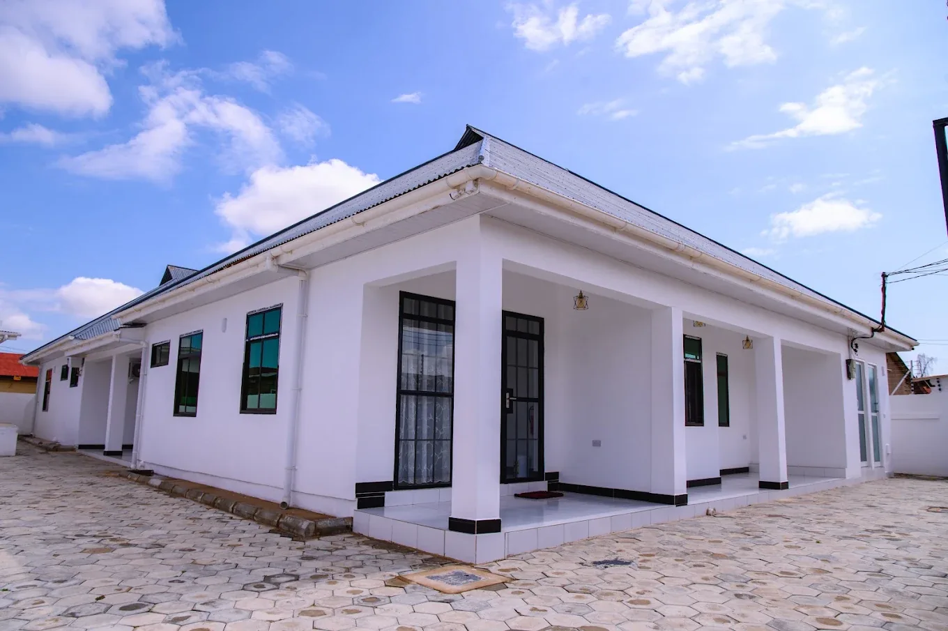 CityWalk Lodge, a white single-storey building with a covered veranda