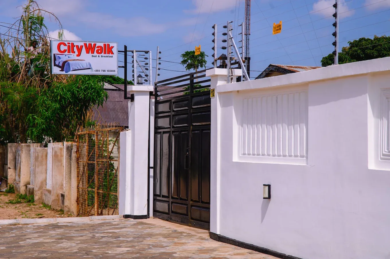 The lodge gate and CityWalk Bed & Breakfast sign