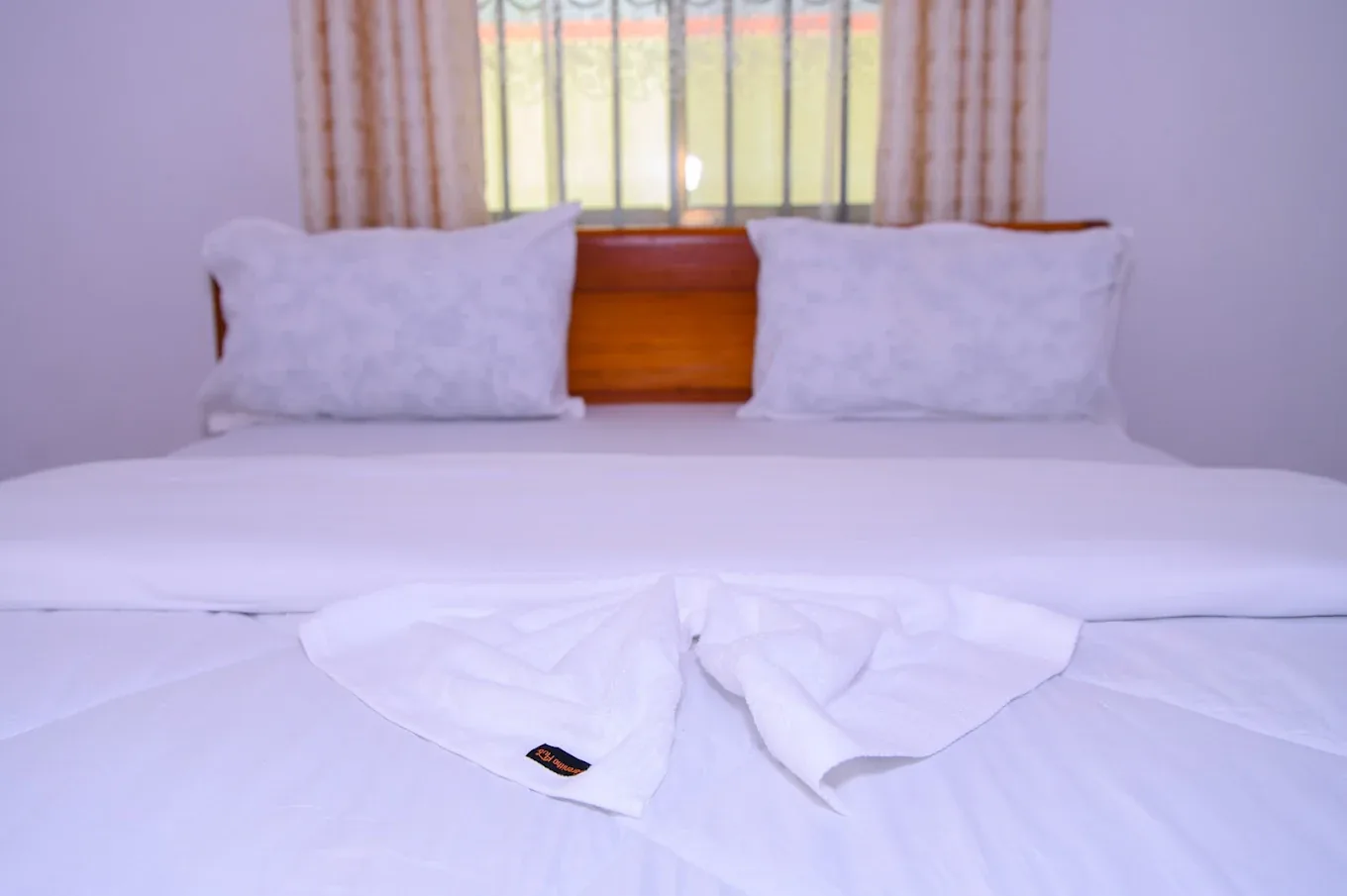 Double bed made up with fresh white linen